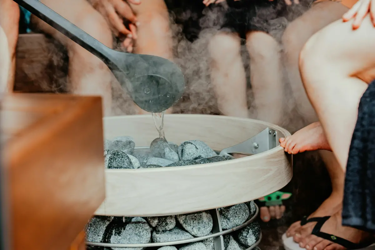 steam or löyly rising from a sauna heater