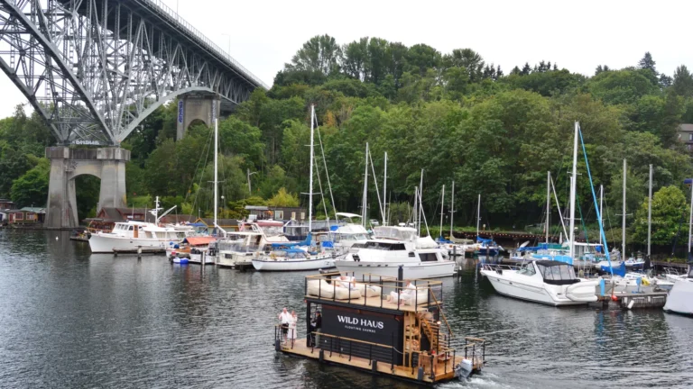 The Wild Haus floating sauna boat on Lake Union under the Aurora Bridge in Seattle