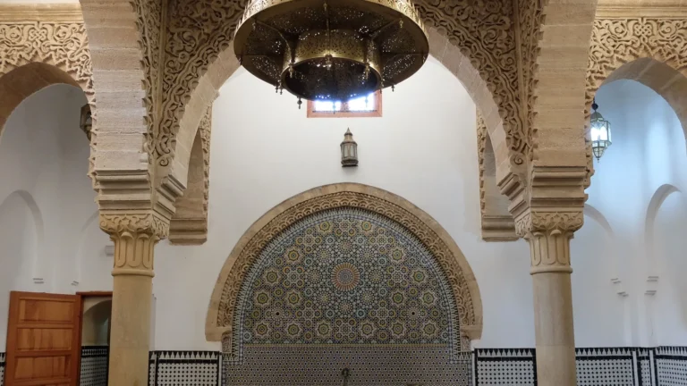 The zellij-tiled reception hall of the restored 14th-century Hammam Saffarin in Fes
