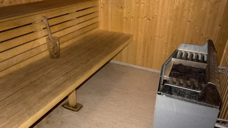 Diagram: three steps to size an electric sauna heater, with Harvia KIP rated room volumes and a worked example